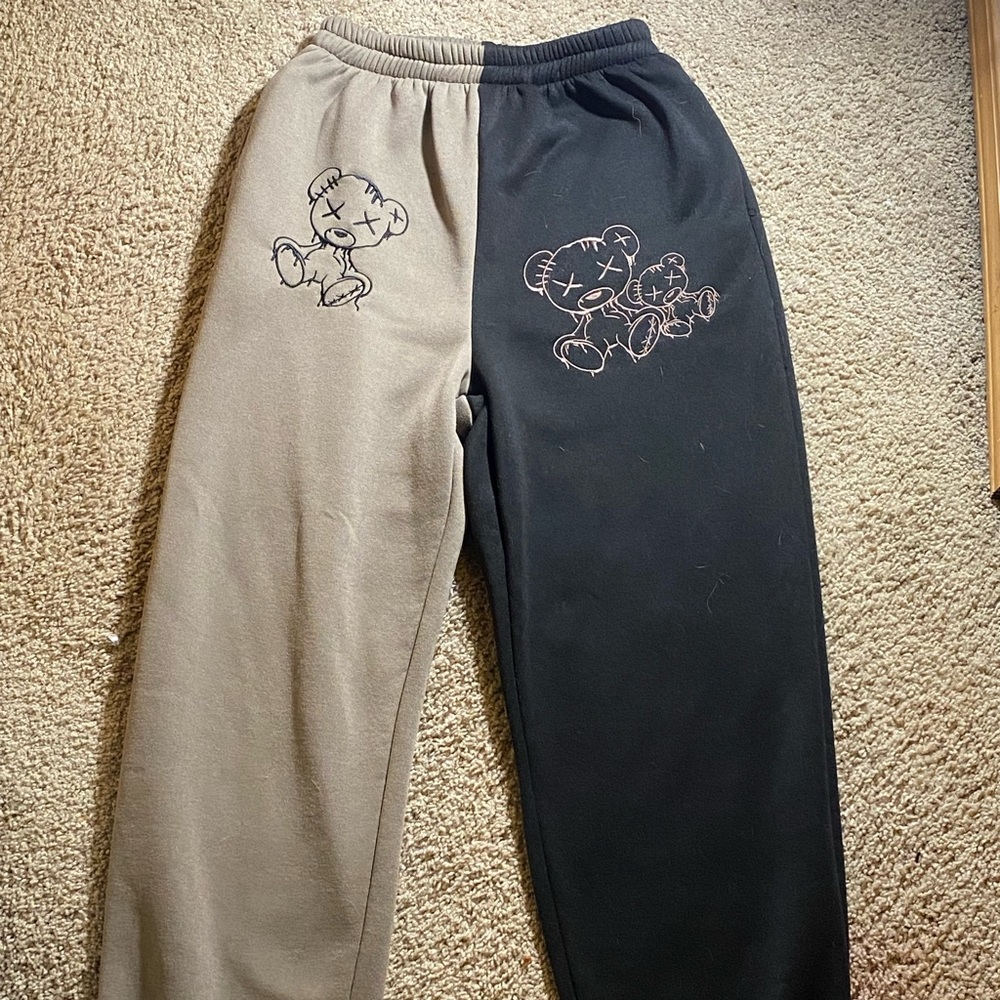Brown and black pants with cartoon bear